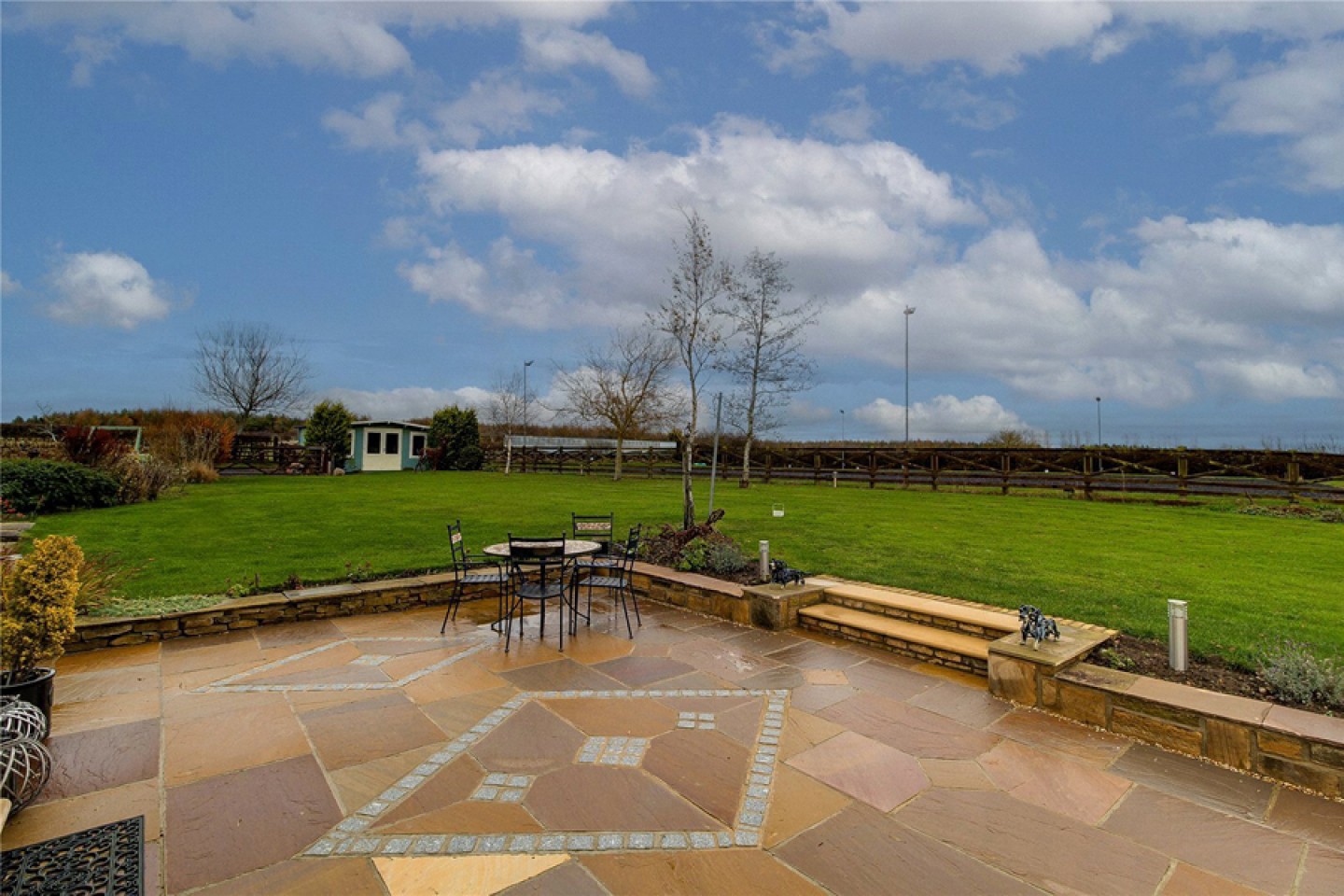 Patio area with lawned area to the back